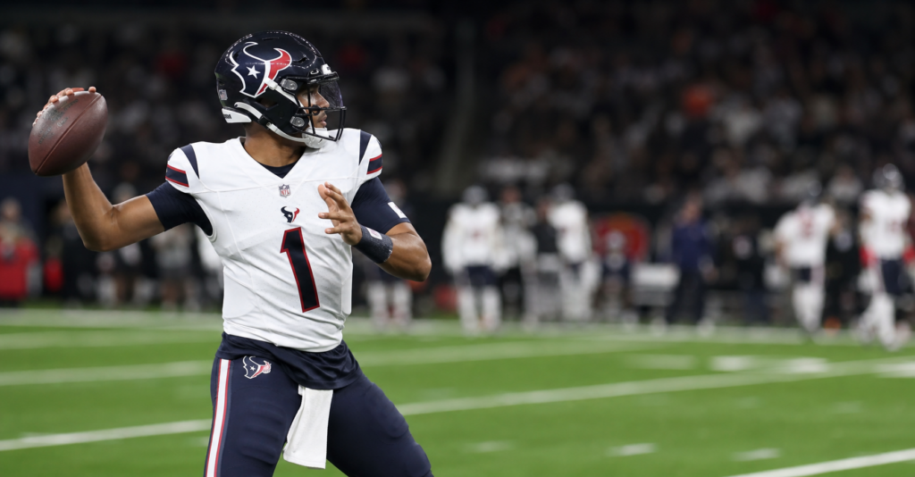 quarterback throws football