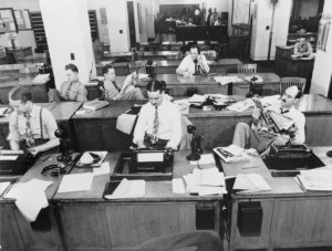 Journalists reviewing a press release