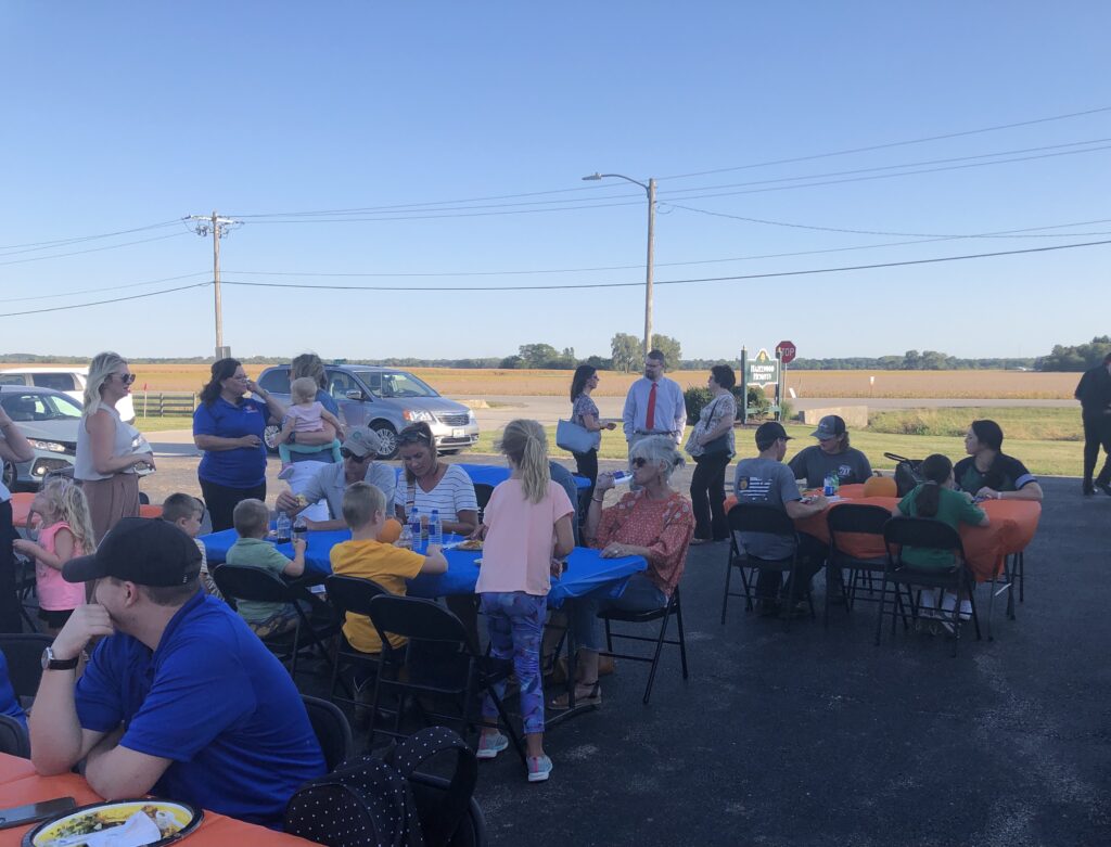 People eating at Team WTI open house