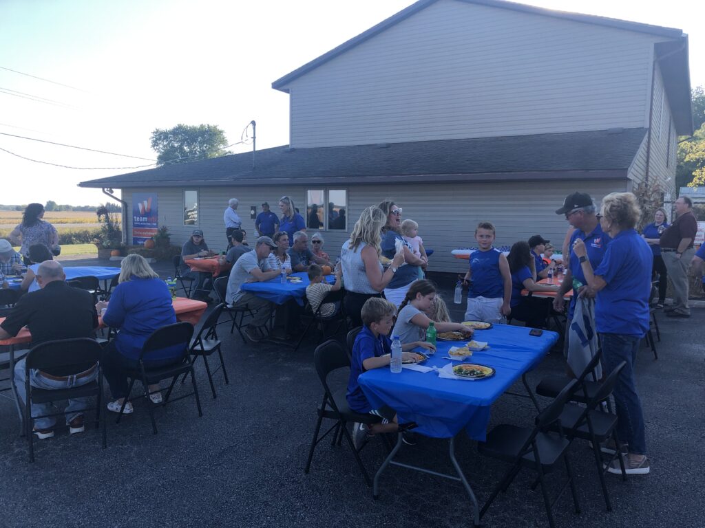 People eating at Team WTI open house