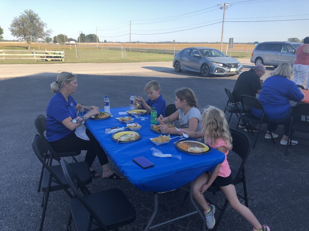 People eating at Team WTI open house
