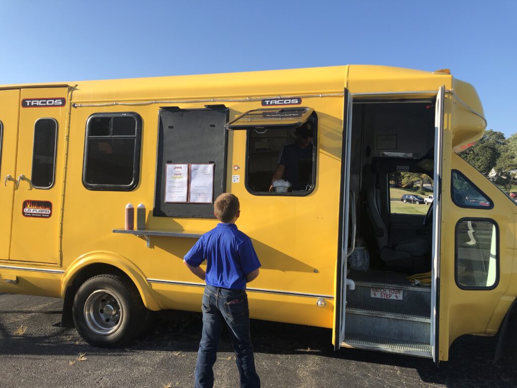 Trying to decide what to get from the food truck at the Team WTI open house. 