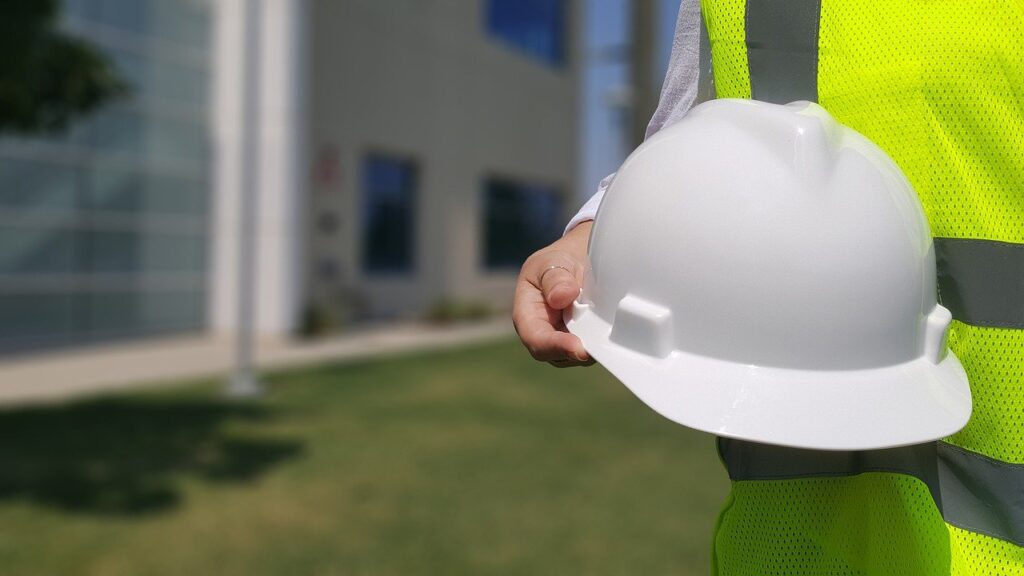 A general contractor holding a hardhat