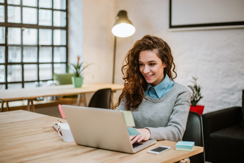 woman typing on laptop