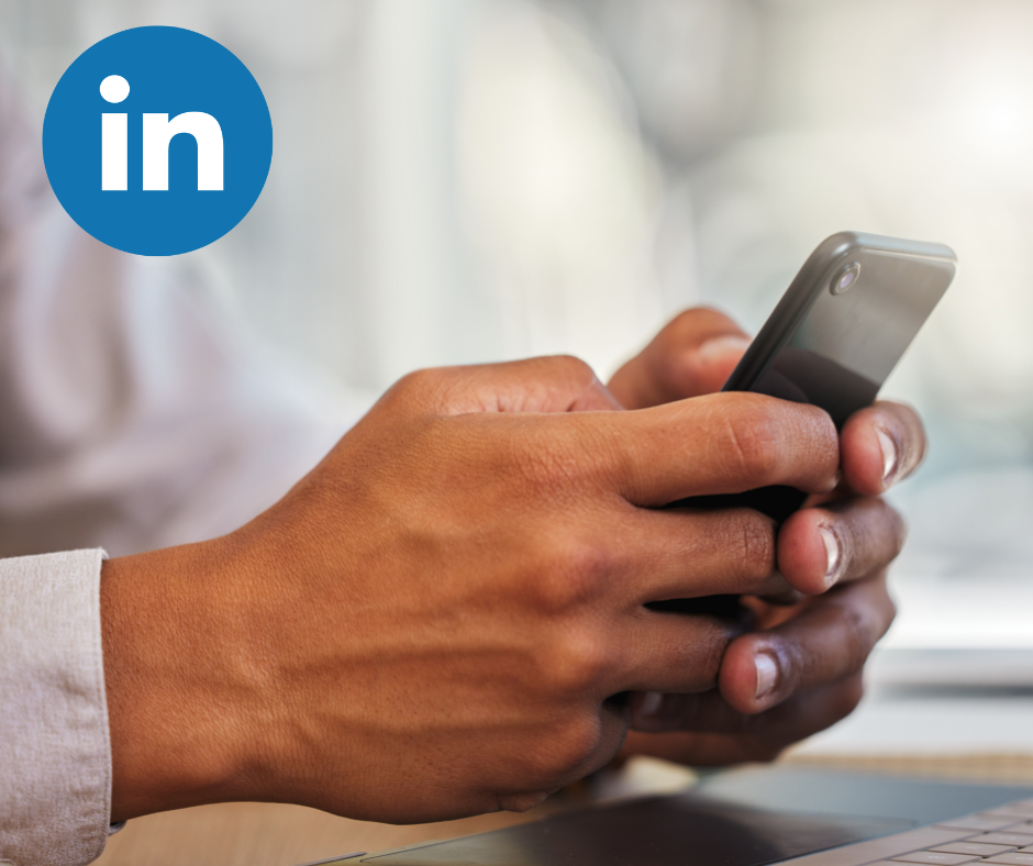 Business man on phone viewing LinkedIn app
